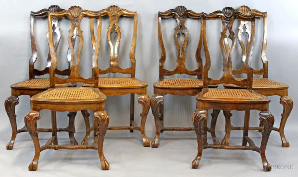 Lotto di sei sedie in noce con particolari intagliati, seduta in cannettè, XX secolo, (difetti)