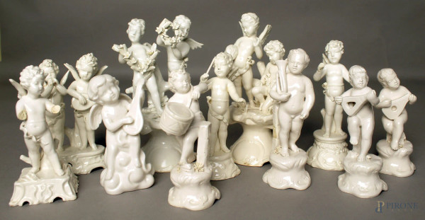 Lotto composto da undici sculture in porcellana bianca raffiguranti putti musicanti, marcate, H massima 19 cm, (difetti).