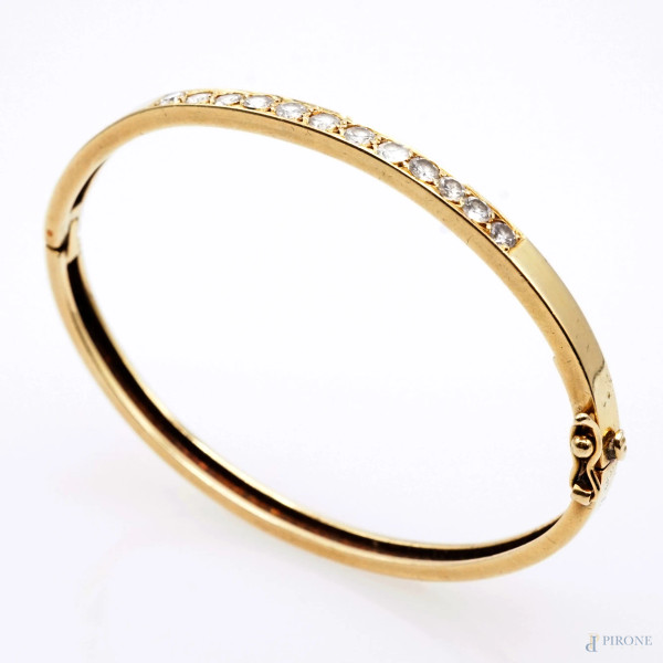 Bracciale rigido in oro 18 KT con 12 brillanti, peso gr. 14