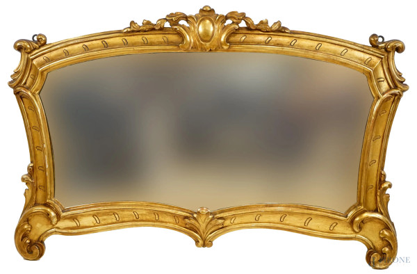 Specchiera di linea sagomata in legno intagliato e dorato, prima metà XX secolo, cm 87x130