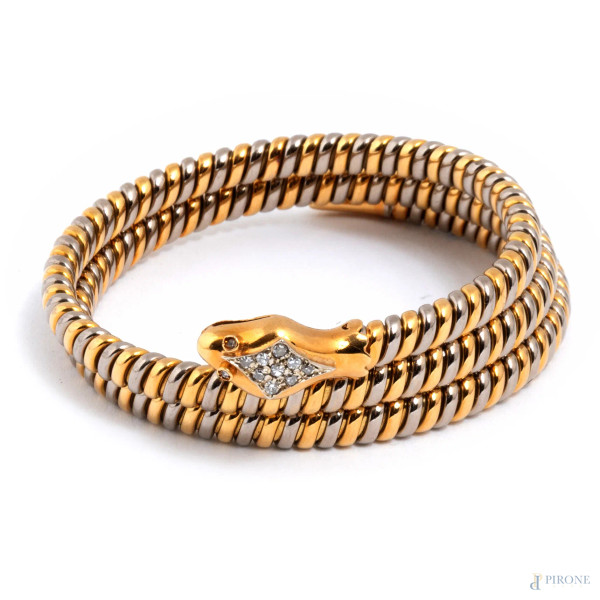 Bracciale semirigido in oro giallo e bianco a guisa di serpente con brillantini, diametro cm 5,5,  peso complessivo gr 53, (lievi segni di usura)