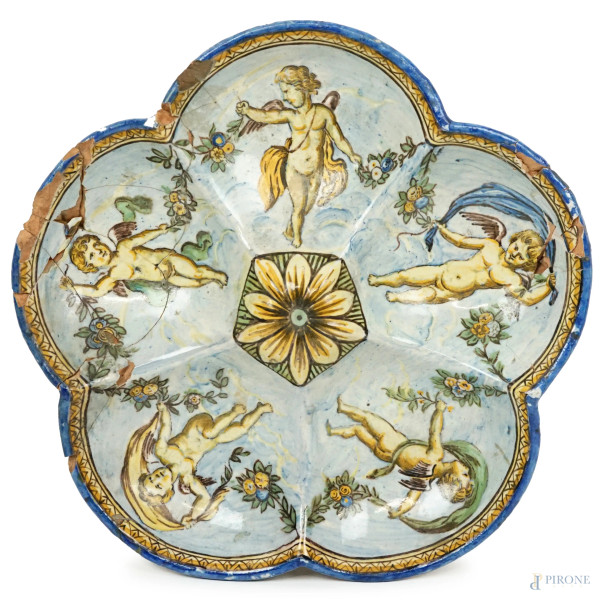 Antica crespina in maiolica dipinta in policromia con vaschette decorate a motivo di putti alati con festoni, cm h 4x24, (difetti e restauri)