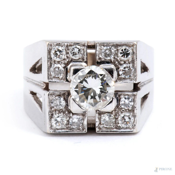 Anello in oro bianco con centrale brillante entro pavè di diamanti, peso lordo complessivo gr 10,...