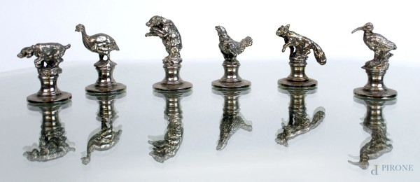 Lotto di sei fermaposto in metallo argentato raffiguranti animali, altezza max cm 3, XX secolo.