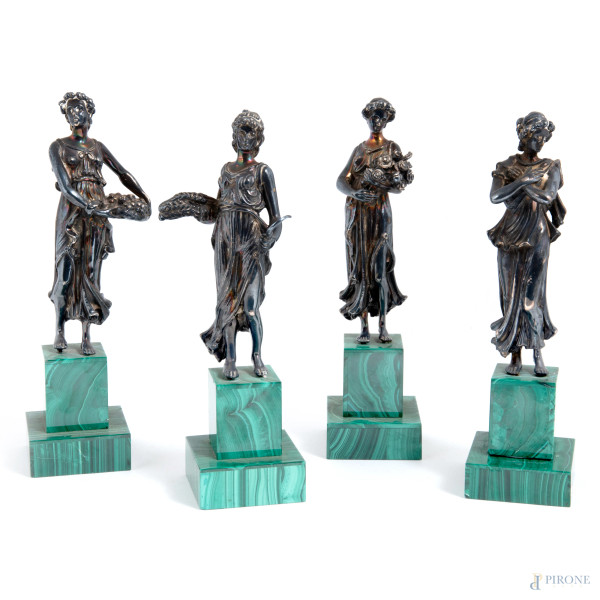 Lotto di quattro sculture raffiguranti allegorie delle quattro stagioni in argento 925/000 su base in malachite, XX secolo, altezza massima cm 20, (rotture)