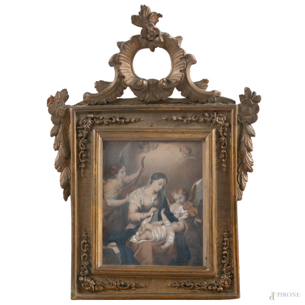 Cornice in legno intagliato, dorato e intagliato  a motivi vegetali e floreali contenente stampa raffigurante Madonna con Bambino, XX secolo, misure complessive cm 52x38; luce cm 23x19, (segni di usura, scalfiture, rotture, mancanze, difetti)