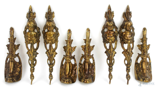 Otto guarnizioni in metallo dorato, XIX-XX secolo, altezza max cm. 20,5