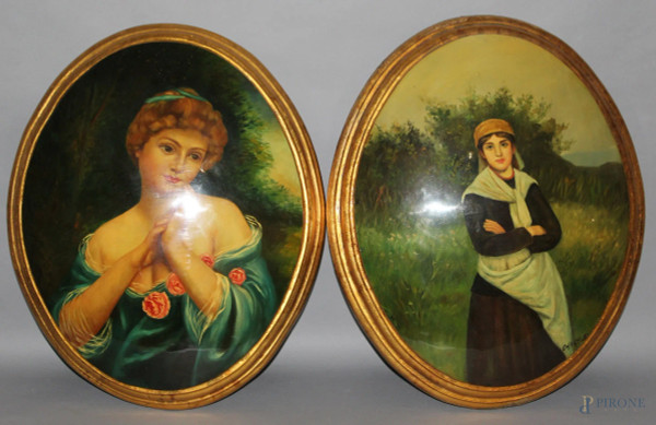 Coppia di dipinti raffiguranti fanciulle, olio su resina ad assetto ovale cm 58x50,(un dipinto reca rottura sul bordo).