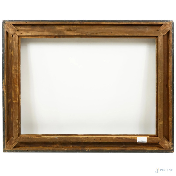 Cornice modanata in legno ebanizzato con profilo interno dorato, XX secolo, ingombro cm 104x80, b...