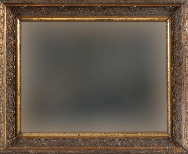 Specchiera in stucco e legno intagliato e dorato con ricco intaglio a volute e girali fogliati, XIX-XX secolo, cm 82,5x66,5, (segni di usura, difetti)