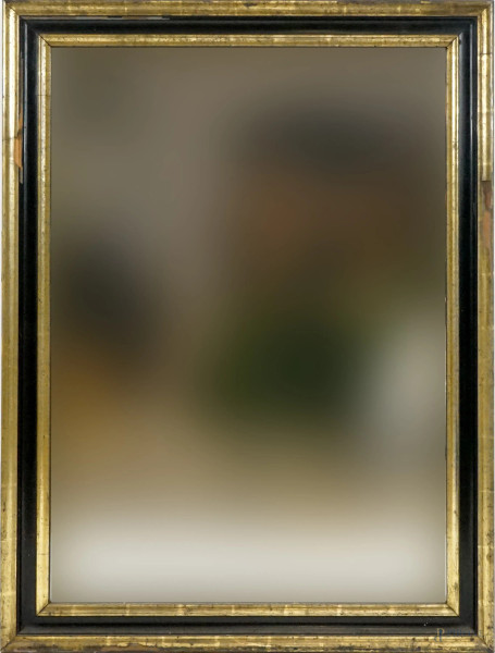 Specchiera di linea rettangolare in legno ebanizzato e dorato, XX secolo, misure ingombro cm 105x78, misure luce cm 90x63, (difetti).