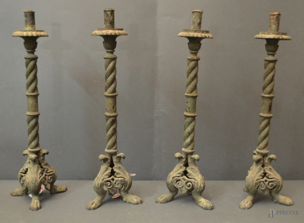 Lotto di due coppie di candelieri diversi in metallo, h. max 45 cm.