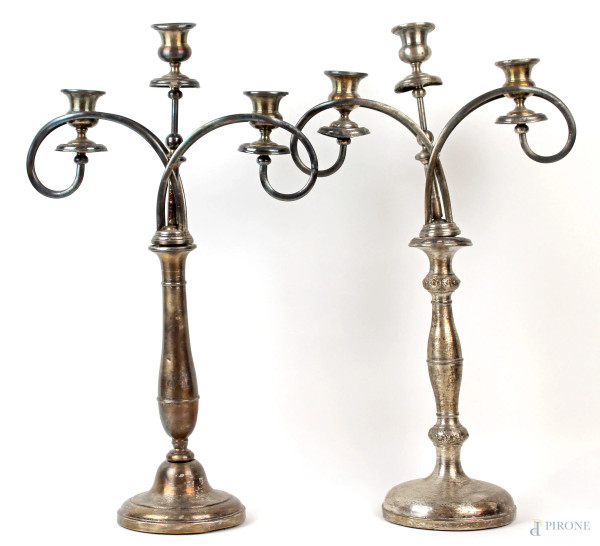 Due candelabri Liberty in metallo argentato a tre fiamme, fusti non pertinenti, cm h 52x30x13,5, (difetti, parte rotta)