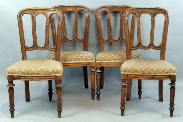 Quattro sedie in noce del XIX secolo, schienali a giorno, gambe tornite, sedute imbottite, altezza cm 88, (segni del tempo)
