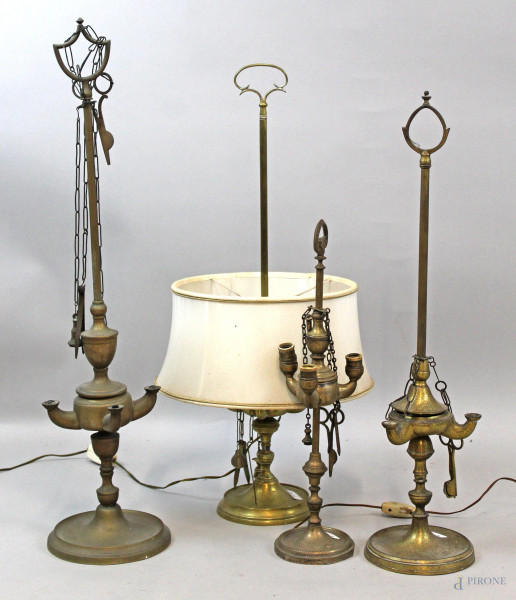 Lotto di quattro lampade fiorentine in bronzo e ottone, alt. max cm 69, (difetti).