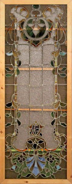 Vetrata con vetri colorati e piombati a decoro floreale, periodo Liberty, cm 184x68.
