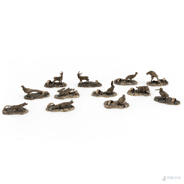 Lotto di 12 segnaposto in argento 800/000 a guisa di animali, misure massime cm 3,5x6, peso complessivo gr 340, (segni di usura)