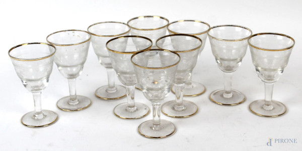 Lotto di dieci bicchierini da liquore in vetro con finiture dorate, cm 8,5, XX secolo, (difetti).