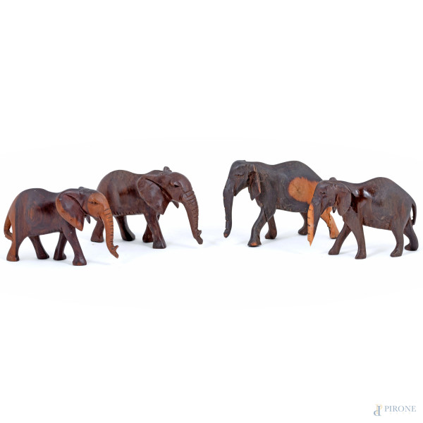 Lotto di quattro elefantini in legno, XX secolo, misure massime  cm 9, (segni di usura)