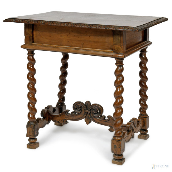 Tavolinetto in noce a un cassetto riccamente intagliato a volute vegetali, con gambe tortili raccordate, XX secolo, cm 83x83x58, (segni di usura, scalfiture, rotture)