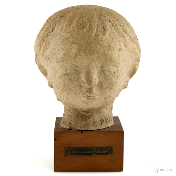 Lorenzo Pepe  (1912-1984), Testa di fanciullo, litoceramica su base in legno, altezza complessiva cm 20, firmato, (segni di usura)