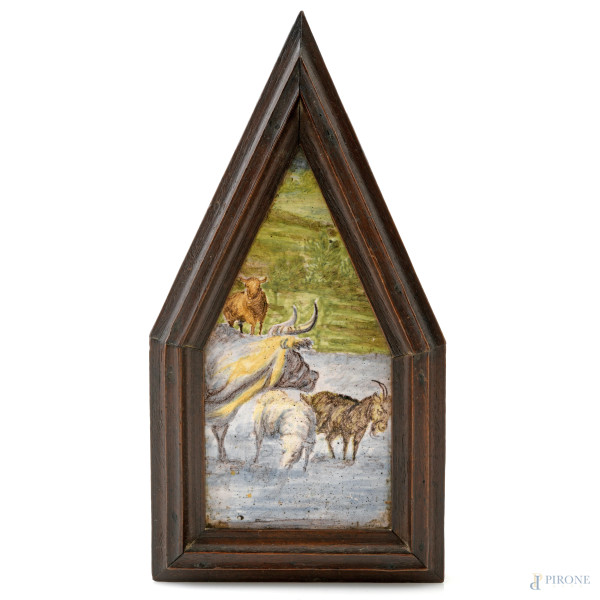Placca in maiolica dipinta raffigurante armenti al ruscello, XX secolo, misure complessive entro cornice cm 19,5x10, (segni di usura, difetti)