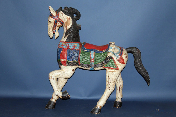 Cavallo gioco in legno intagliato e dipinto,inizi '900,h 98 cm,lungh.90 cm.