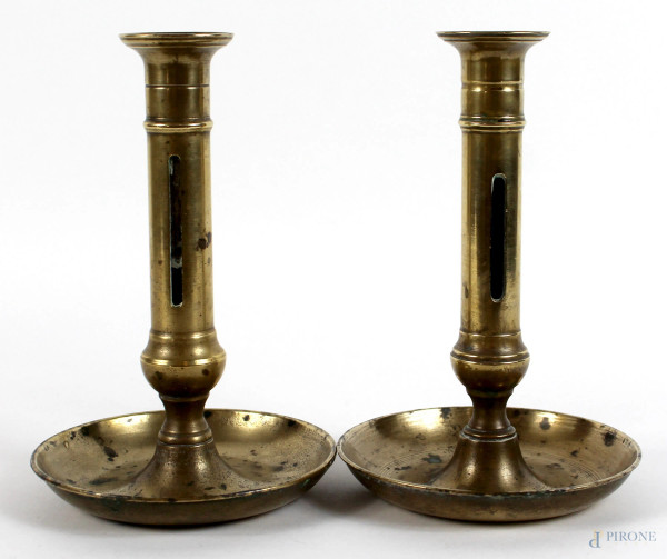 Coppia di candelieri in metallo dorato, altezza cm. 19,5, (difetti).