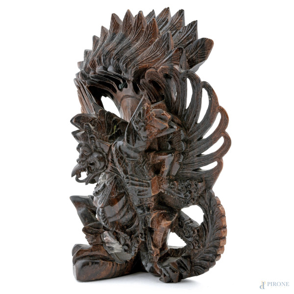 Lotto di due maschere e una scultura a rilievo in legno di teak, XX secolo, misure massime cm 25,...