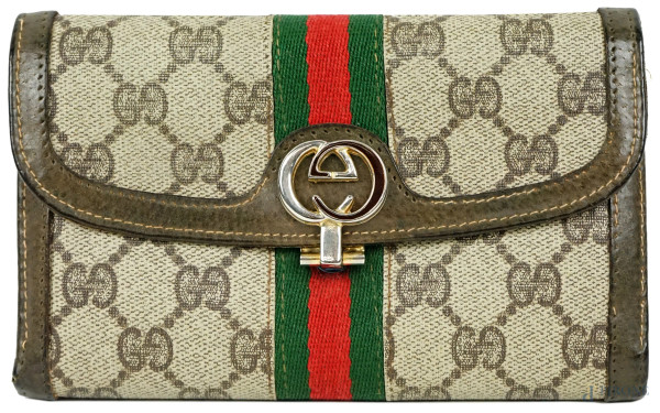Gucci, portafoglio vintage in tela e cuoio con chiusura a monogramma, cm 10,5x17, (segni di utilizzo).