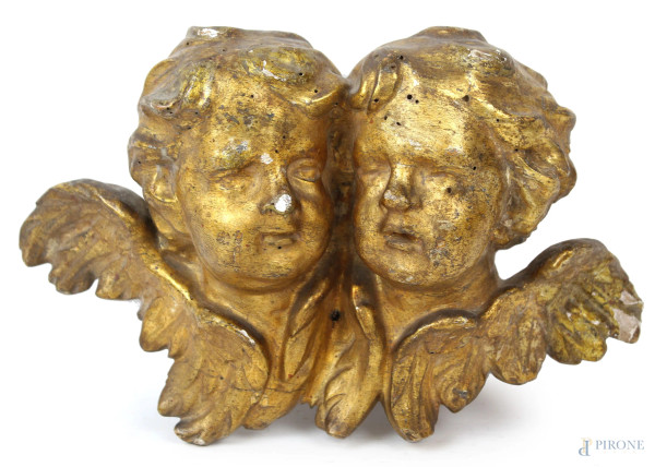 Teste di cherubini in legno intagliato e dorato, XVIII secolo, cm 20x32,5x13, (piccole cadute di doratura, segni del tempo)