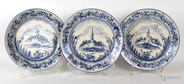 Tre piatti in ceramica bianca e blu a decoro di paesaggi, marcati MGA Mazzotti Giuseppe Albisola, prima metà XX secolo, diametro cm 22, (filature)
