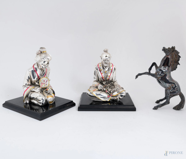 Lotto di tre sculture in metallo galvanizzato, XX secolo, misure massime cm 22x19x17, (segni di usura, difetti)