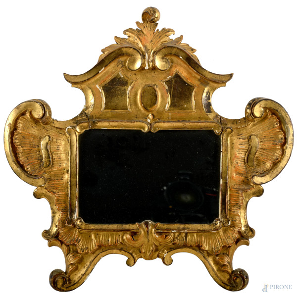 Cornice in legno dorato e intagliato montata a specchio, XX secolo, cm 43x48,5, (difetti)