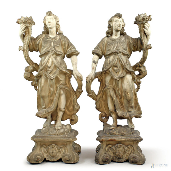 Coppia di angeli con cornucopia, XVIII secolo, base in legno intagliato e laccato, cm h 96, (segni del tempo).