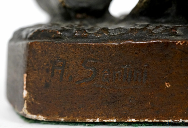 Scultura in gesso policroma rappresentante una donna con un pastore tedesco, firmata A. Santini, ...