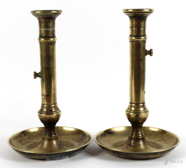Coppia di candelieri in metallo dorato, altezza cm. 24,5, (difetti).