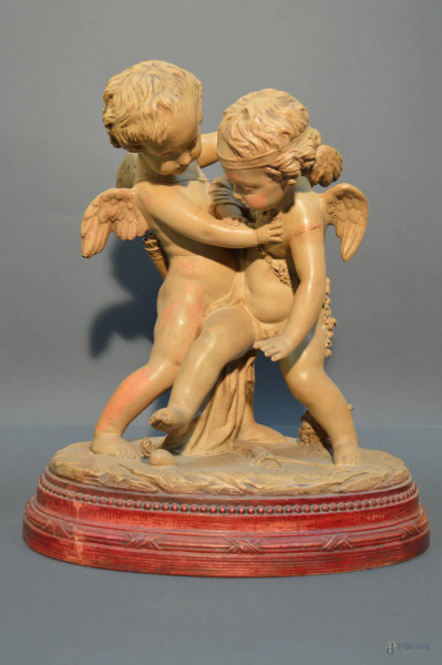 Amorini, scultura in terracotta policroma poggiante su base, Francia XIX sec, h.45x40 cm, (restauri).
