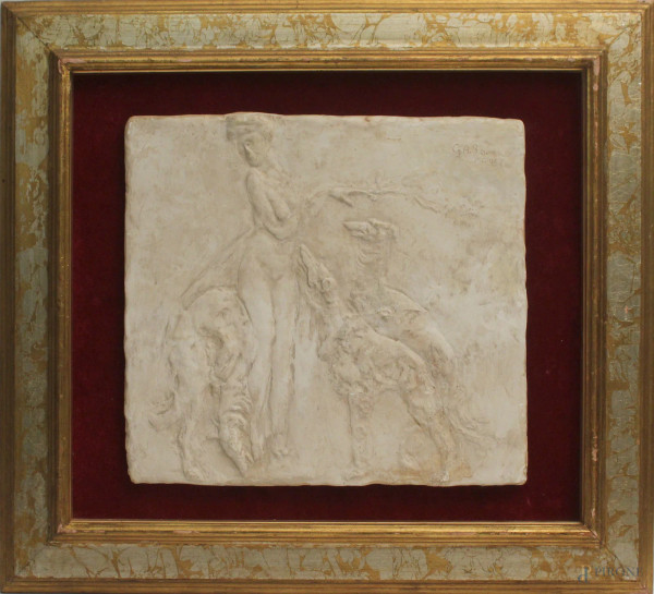 Placca in gesso, raffigurante donna con cani, cm. 31X 33, recante firma G.A. Sartorio, datato MCMXX, entro cornice.