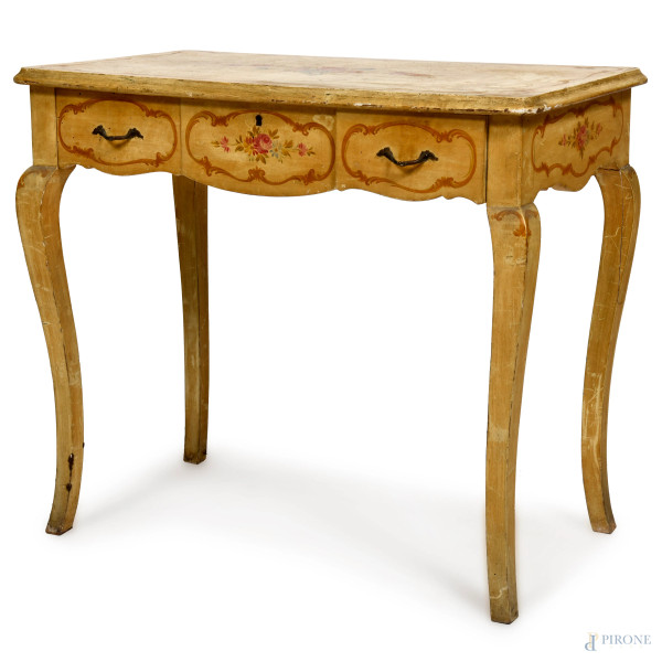 Scrittoio in legno laccato e decorato a motivi floreali, con tre cassetti e gambe mosse, XX secolo, cm 76x87x50, (segni di usura, cadute colore, scalfiture, fessurazioni)