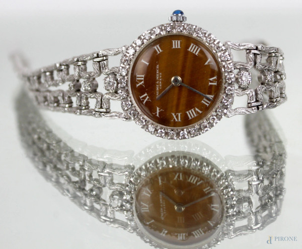 Baume & Mercier Geneve, orologio in oro bianco 18kt con diamantini, quadrante occhio di tigre a numeri romani, lunghezza cm 19, (meccanismo da revisionare)