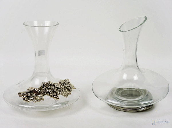 Due decanter in vetro, decori e base in metallo argentato, alt. max cm 29, XX secolo, (lievi difetti).
