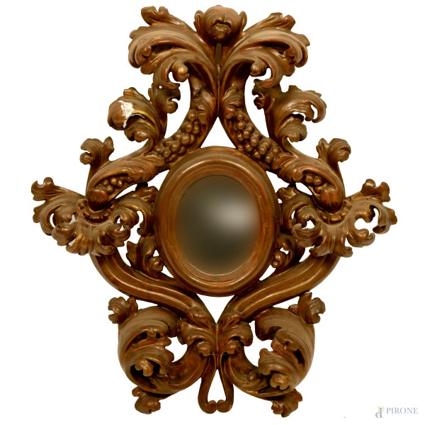 Specchio con cornice in legno intagliato e con decori traforati a volute vegetali, cm 73,5x63