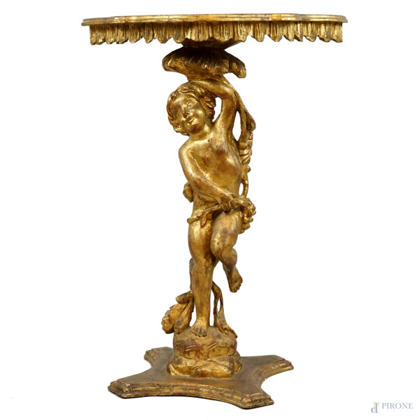 Tavolino in legno intagliato e dorato, XX secolo, piano sorretto da montante scolpito a foggia di putto,  poggiante su pianetto alla base, cm h 71x53x29, (difetti).