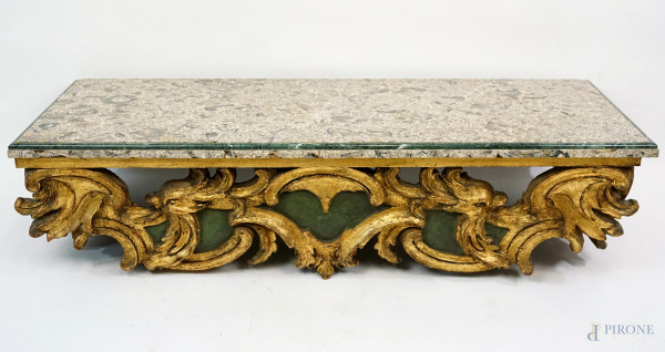 Consolle in legno riccamente scolpito, dorato e laccato verde, fine XIX-inizi XX secolo, piano in marmo  tipo "lumachella", cm h 23x102,5x43, (difetti)