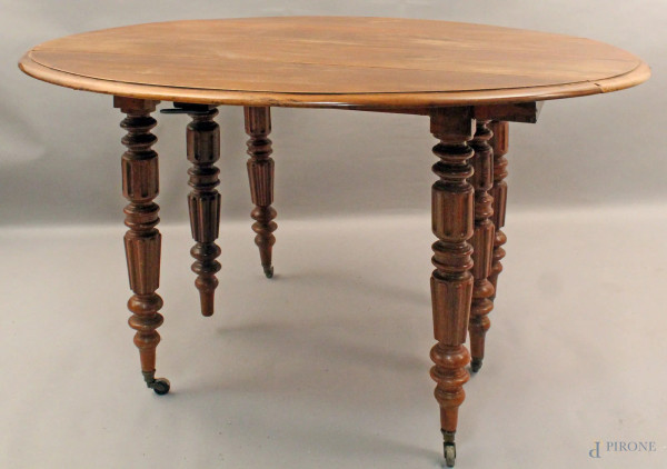 Tavolo a bandelle in mogano, poggiante su sei gambe, XIX sec., H 77 cm, diametro 126 cm.