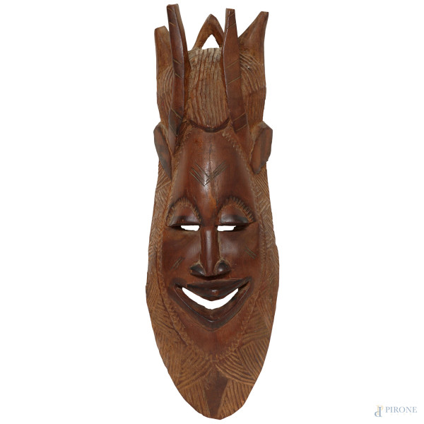 Maschera africana in legno intagliato, XX secolo, cm 60x19