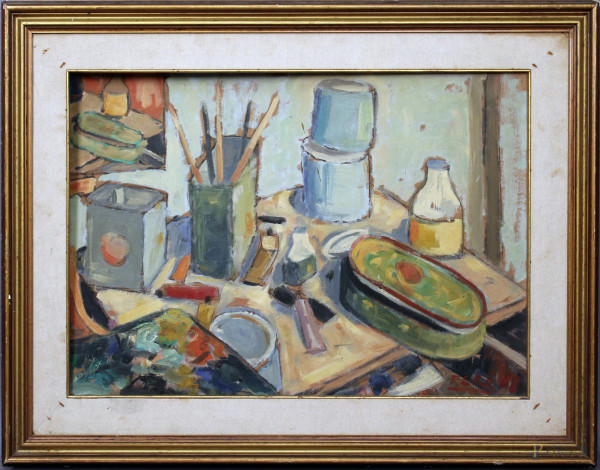 Il tavolo del pittore, olio su cartone, cm. 50x71, firmato e datato, entro cornice.