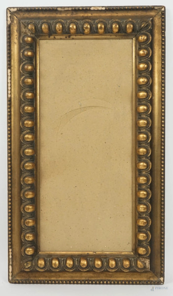 Cornice in legno intagliato e dorato, misure ingombro cm 70x40, misure luce cm 56,5x26, prima metà XX secolo, (difetti).