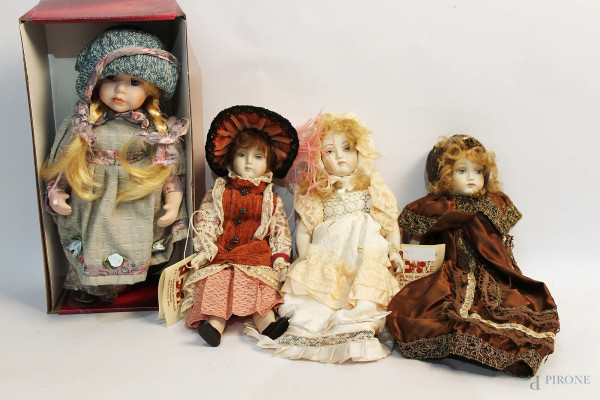 Lotto di quattro bambole in porcellana, h max 30 cm.